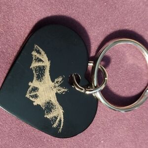 Heart-Shaped Keychain with Bat Design